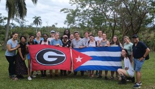 Group with UGA and Cuba flag